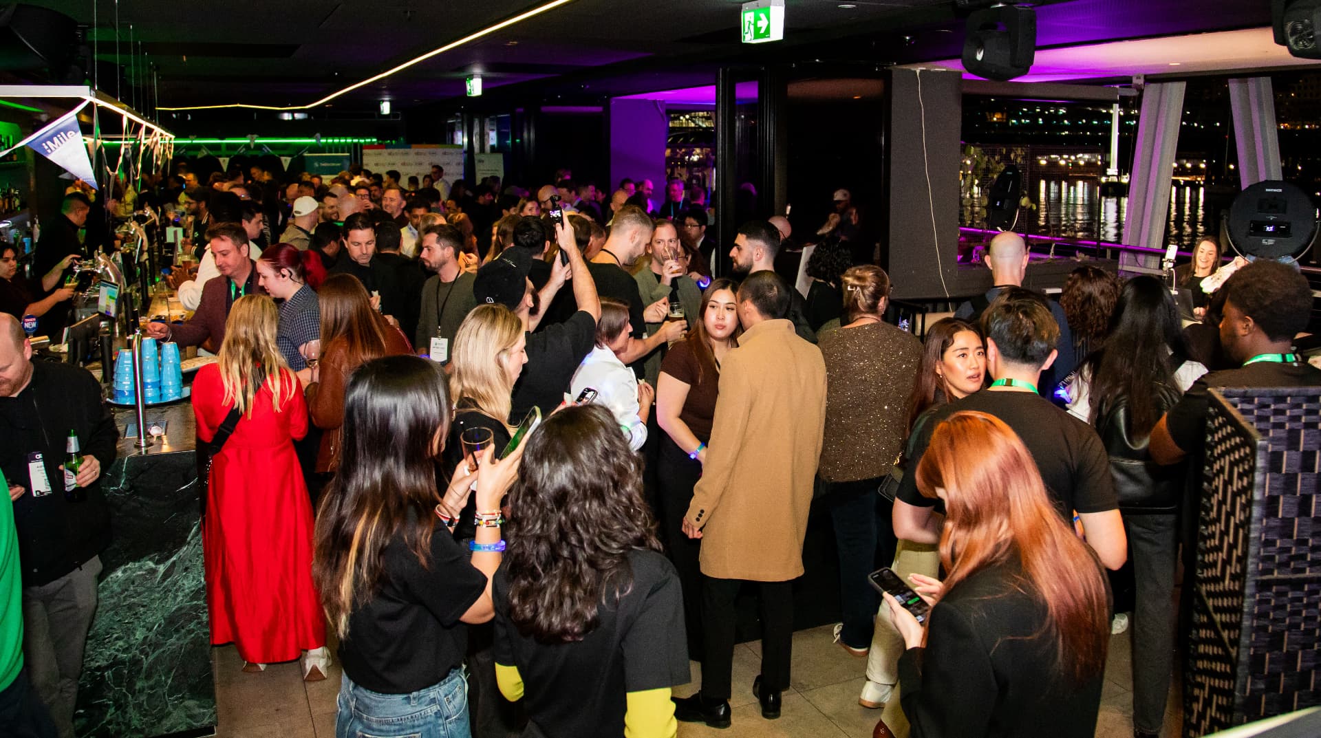 A packed Retail Community networking event with retail professionals talking over drinks